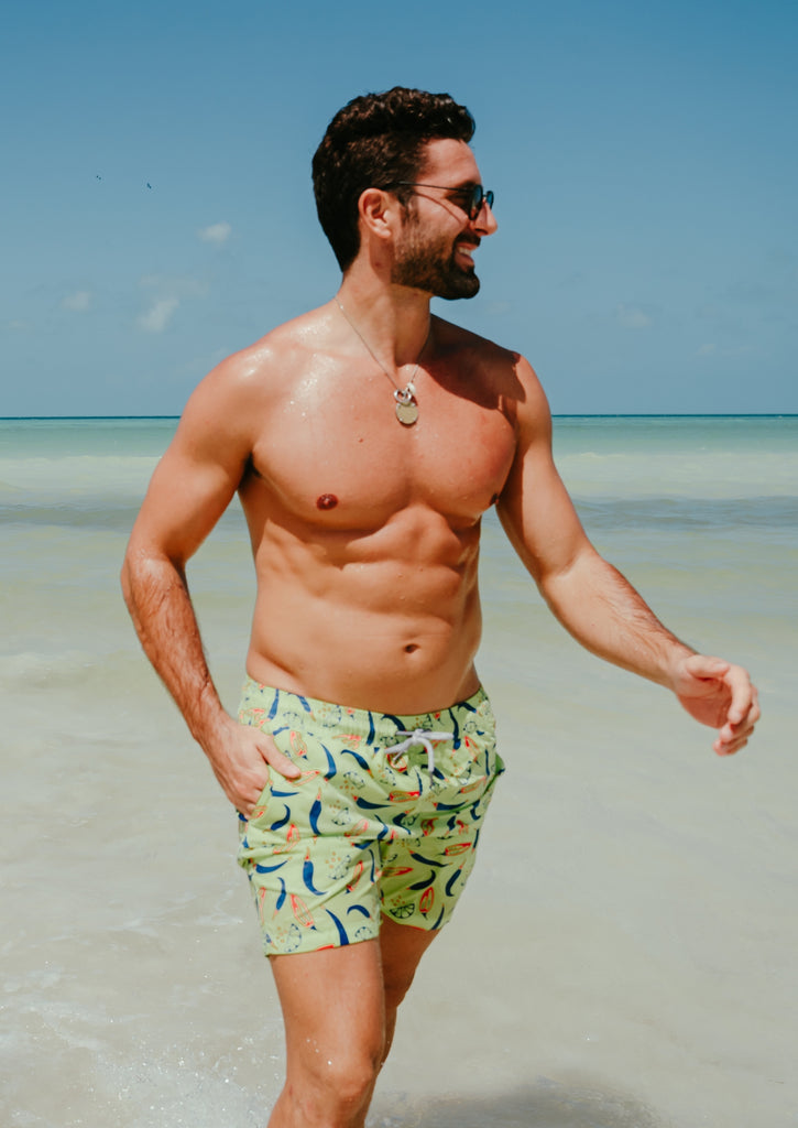 Mens Swim shorts and swimming trunks by Tom and Teddy The perfect beach boardshorts in matching father and son sizes and styles. Visually shown shorts on two men on the beach